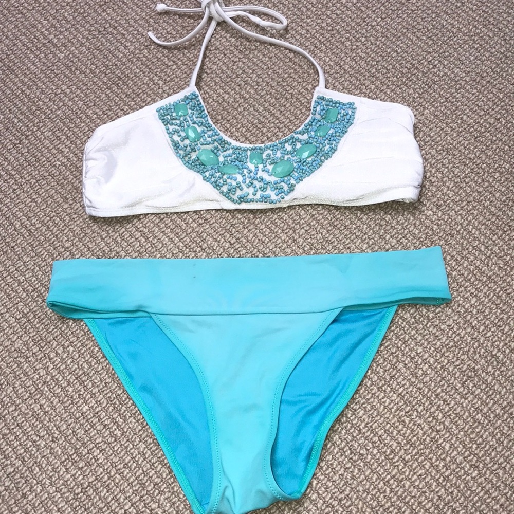 White bikini with blue jewel detail and blue btms